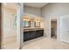 Bathroom showing dual sinks, shower stall, and tile floors at 8124 Bay Harbor Dr, Las Vegas, NV 89128