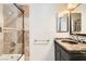 Well-lit bathroom featuring a shower with glass door and a sink with marble countertops at 8124 Bay Harbor Dr, Las Vegas, NV 89128