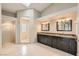 Bathroom boasting dual sinks, dark cabinetry, and a large shower at 8124 Bay Harbor Dr, Las Vegas, NV 89128