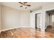 Bright bedroom featuring hardwood floors, closet, and natural light from the window at 8124 Bay Harbor Dr, Las Vegas, NV 89128
