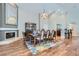 Bright dining room features hardwood floors, fireplace, and elegant chandelier at 8124 Bay Harbor Dr, Las Vegas, NV 89128