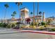 Attractive building exterior showcasing a tower entrance, mature landscaping, and palm trees at 8124 Bay Harbor Dr, Las Vegas, NV 89128