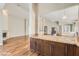 Open kitchen with granite countertops and breakfast bar at 8124 Bay Harbor Dr, Las Vegas, NV 89128