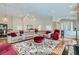 Expansive living room with hardwood floors, comfortable seating, and open layout at 8124 Bay Harbor Dr, Las Vegas, NV 89128