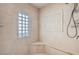 Shower stall with tiled bench and window at 8124 Bay Harbor Dr, Las Vegas, NV 89128