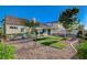 Backyard showcases a covered patio, low-maintenance landscaping, and mature trees at 832 Seco Verde Ave, Henderson, NV 89015