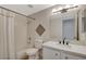 Bathroom featuring a single vanity, quartz counters, updated faucet and shower-tub combo at 832 Seco Verde Ave, Henderson, NV 89015