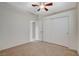 Bedroom featuring neutral walls, carpet, ceiling fan and closet with sliding doors at 832 Seco Verde Ave, Henderson, NV 89015