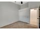 Carpeted bedroom featuring a ceiling fan, closet with sliding doors and neutral paint at 832 Seco Verde Ave, Henderson, NV 89015