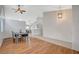 Open-concept dining area with hardwood floors and a view into other living spaces at 832 Seco Verde Ave, Henderson, NV 89015