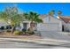 Inviting single-story home with a two-car garage and tidy landscaping at 832 Seco Verde Ave, Henderson, NV 89015