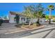 Single-story home with low-maintenance desert landscaping and mature trees at 832 Seco Verde Ave, Henderson, NV 89015