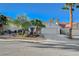 Charming single-story home with a well-maintained lawn and mature palm trees at 832 Seco Verde Ave, Henderson, NV 89015
