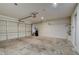 This is an image of the garage with a garage door, concrete floors and white walls at 832 Seco Verde Ave, Henderson, NV 89015