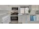 Well-lit kitchen features stainless appliances and bright, white cabinets at 832 Seco Verde Ave, Henderson, NV 89015