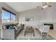 Bright living room featuring vaulted ceiling, fireplace, and large window for natural light at 832 Seco Verde Ave, Henderson, NV 89015