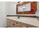 Bathroom featuring a unique floral mirror and tiled backsplash at 8337 Willow Basin Ct, Las Vegas, NV 89131