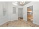 Dining room featuring neutral paint, tiled flooring with decorative borders, and ample natural light at 8337 Willow Basin Ct, Las Vegas, NV 89131
