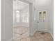 Bright foyer featuring neutral paint, tiled flooring with decorative borders, and natural light at 8337 Willow Basin Ct, Las Vegas, NV 89131