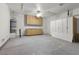 Bright and spacious garage with a ceiling fan and built-in cabinets at 8337 Willow Basin Ct, Las Vegas, NV 89131