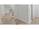 Bright hallway featuring neutral paint and tiled flooring with decorative borders at 8337 Willow Basin Ct, Las Vegas, NV 89131