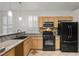 Efficient kitchen featuring granite countertops, modern appliances, tile backsplash and plenty of cabinet space at 8337 Willow Basin Ct, Las Vegas, NV 89131
