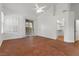 Spacious living room with sliding glass doors, tile floors, and a ceiling fan at 8337 Willow Basin Ct, Las Vegas, NV 89131