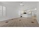 Spacious living room featuring tile flooring, neutral paint, shuttered windows, and abundant natural light at 8337 Willow Basin Ct, Las Vegas, NV 89131