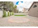 Large backyard features a brick patio, gravel landscaping and mature trees at 8757 Beluga Way, Las Vegas, NV 89117