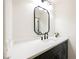 Stylish powder room with a modern sink, sleek fixtures, and a decorative mirror at 8757 Beluga Way, Las Vegas, NV 89117