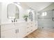 Modern bathroom with double sinks, sleek fixtures, and a glass-enclosed shower at 8757 Beluga Way, Las Vegas, NV 89117