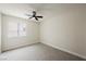 Simple bedroom with carpeted floor and a window allowing natural light at 8757 Beluga Way, Las Vegas, NV 89117