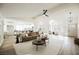 Spacious living room with vaulted ceilings, modern decor, and an open layout to the dining area at 8757 Beluga Way, Las Vegas, NV 89117