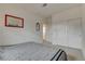 Neutral bedroom featuring plush carpet, large bed and closet storage at 8801 Trotternish Ridge Dr, Las Vegas, NV 89166