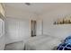 Cozy bedroom featuring double-door closet and warm, neutral tones at 8801 Trotternish Ridge Dr, Las Vegas, NV 89166