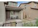 Inviting front porch featuring a covered seating area, brick-paved entrance, and stylish neutral tones at 8801 Trotternish Ridge Dr, Las Vegas, NV 89166