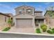 Charming two-story home featuring a neutral color palette, tiled roof, two-car garage, and well-maintained landscaping at 8801 Trotternish Ridge Dr, Las Vegas, NV 89166