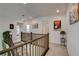 Second story hallway landing with staircase and artwork on walls at 8801 Trotternish Ridge Dr, Las Vegas, NV 89166