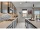 Modern kitchen with stainless steel appliances, lots of countertop space, and sleek backsplash at 8801 Trotternish Ridge Dr, Las Vegas, NV 89166