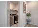 Convenient laundry room with modern washer, dryer, and neutral decor at 8801 Trotternish Ridge Dr, Las Vegas, NV 89166