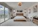 Bright main bedroom with balcony access and modern decor, offering relaxation at 8801 Trotternish Ridge Dr, Las Vegas, NV 89166