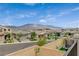 Charming street view features well-maintained homes, landscaped yards, and a peaceful neighborhood ambiance at 8801 Trotternish Ridge Dr, Las Vegas, NV 89166