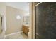 Bathroom showcasing a unique stained glass shower door, vanity, and decorative window for natural light at 9404 Low Tide Ct, Las Vegas, NV 89117