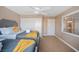 Bedroom featuring twin beds, a ceiling fan, closet and a window with white shutters at 9404 Low Tide Ct, Las Vegas, NV 89117
