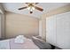 Bedroom featuring a ceiling fan, large closet, neutral paint and a queen-size bed at 9404 Low Tide Ct, Las Vegas, NV 89117