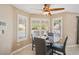 Bright dining area with backyard views and modern plantation shutters at 9404 Low Tide Ct, Las Vegas, NV 89117