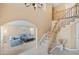 Open concept foyer with arched doorway leading to a comfortable living space at 9404 Low Tide Ct, Las Vegas, NV 89117