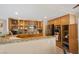 Spacious kitchen features granite countertops, wood cabinets, stainless steel appliances, and ample storage space at 9404 Low Tide Ct, Las Vegas, NV 89117