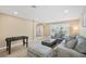 Inviting living room with comfortable seating and games at 9404 Low Tide Ct, Las Vegas, NV 89117