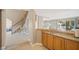 Wet bar area connects to the kitchen and staircase at 9404 Low Tide Ct, Las Vegas, NV 89117